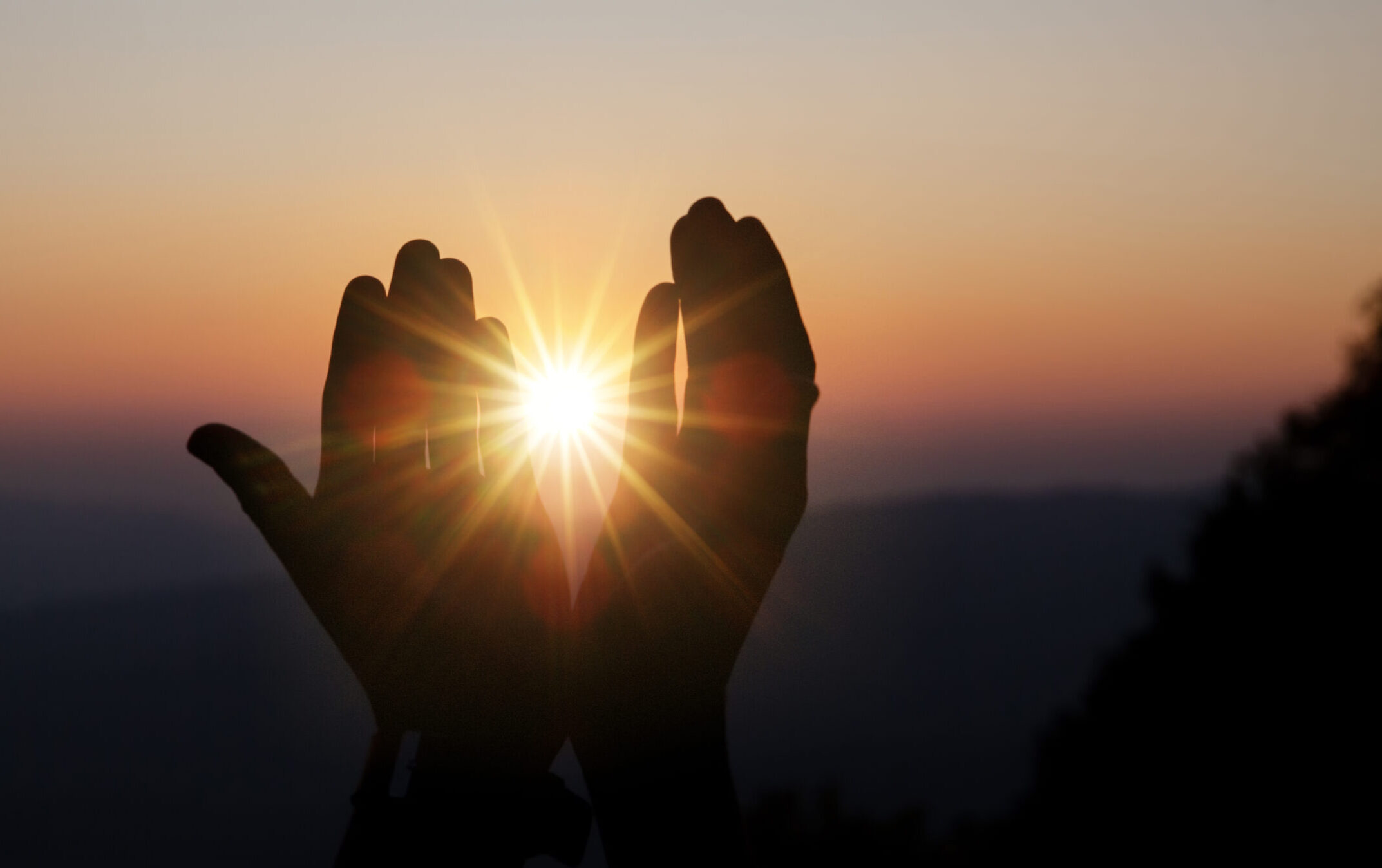 Faith of christian concept: Spiritual prayer hands over sun shin